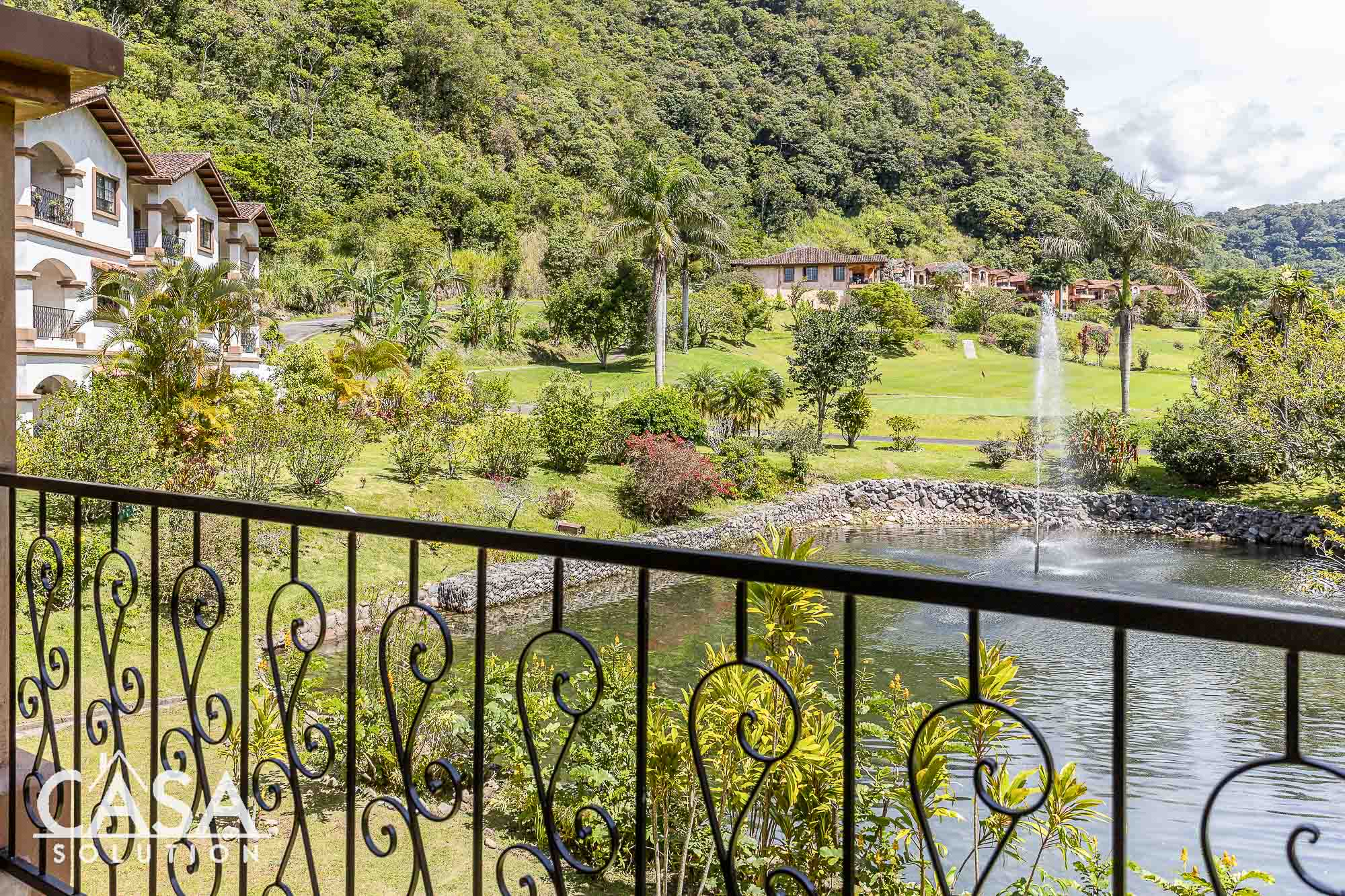 Sold by Casa Solution - Stunning and Furnished Valle Escondido Apartment with Valley, Lake & Golf Course Views for Sale in Downtown Boquete, Panama