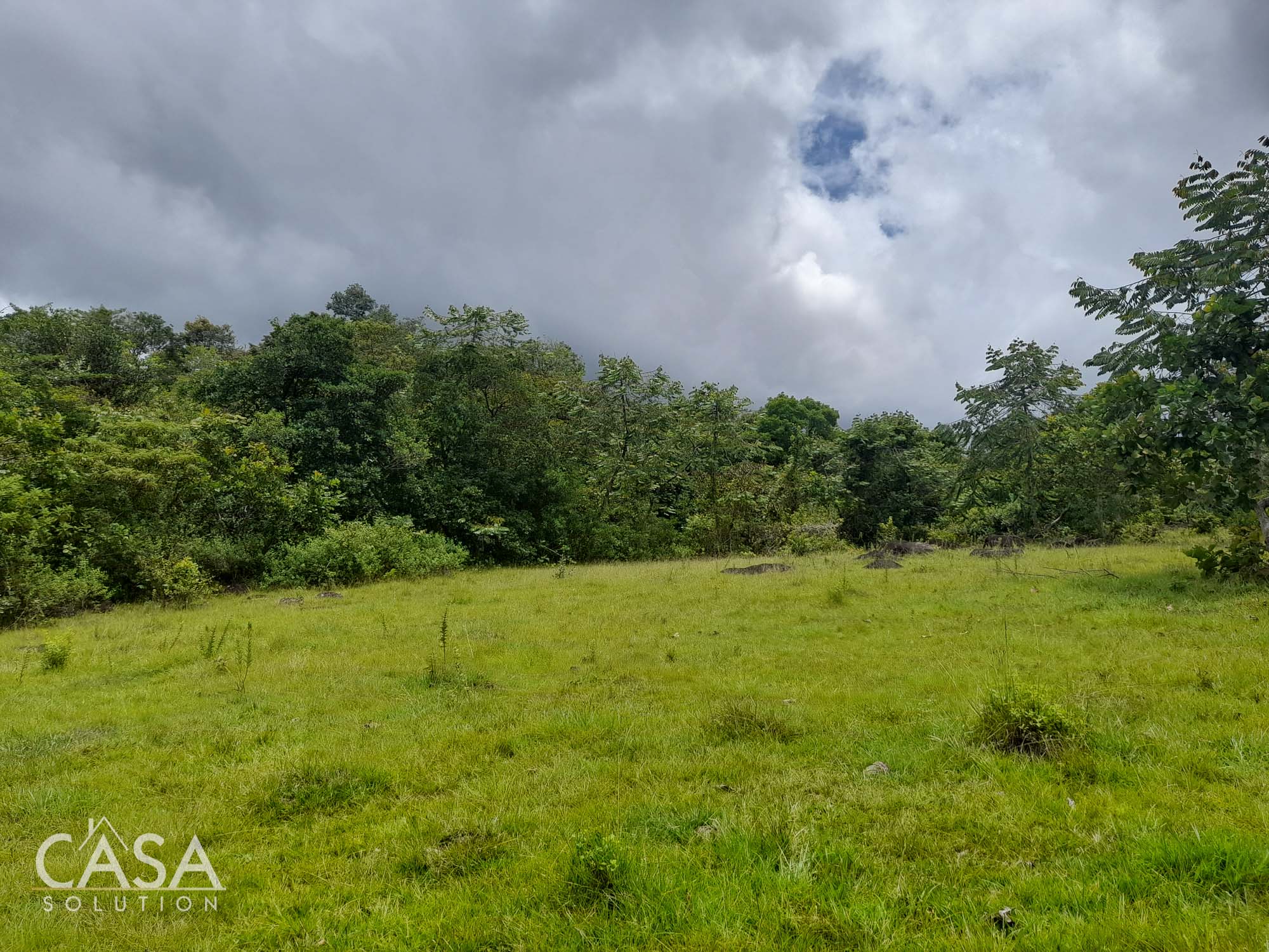 Sold by Casa Solution! Price Reduction! Embrace Tranquility with this 4,000 sqm Lot for Sale with Year-Round Creek and Majestic Mountain Views in Caldera, Chiriqui