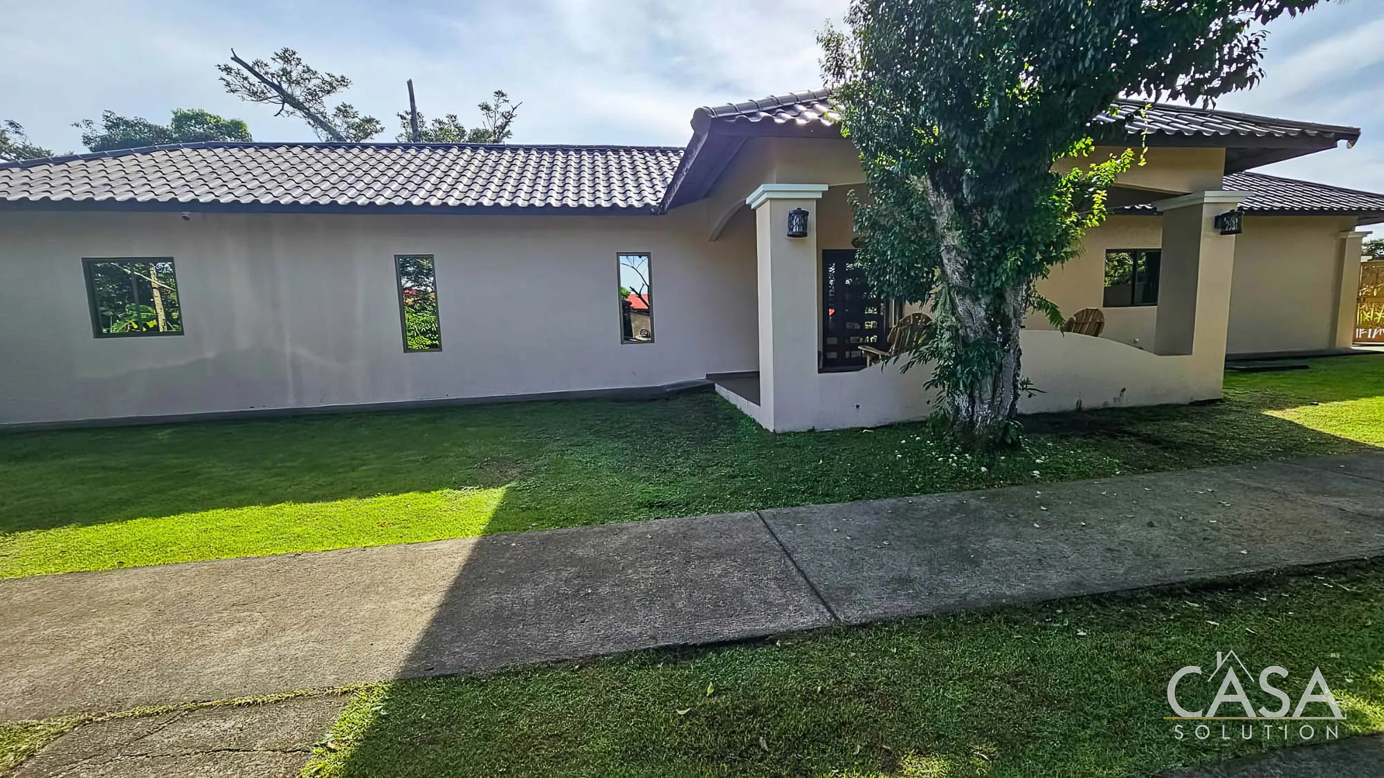 Sold by Owner! Modern 3-bedroom home for Sale in El Valle, Volcán with spacious interiors, a large yard, and a serene streamside setting