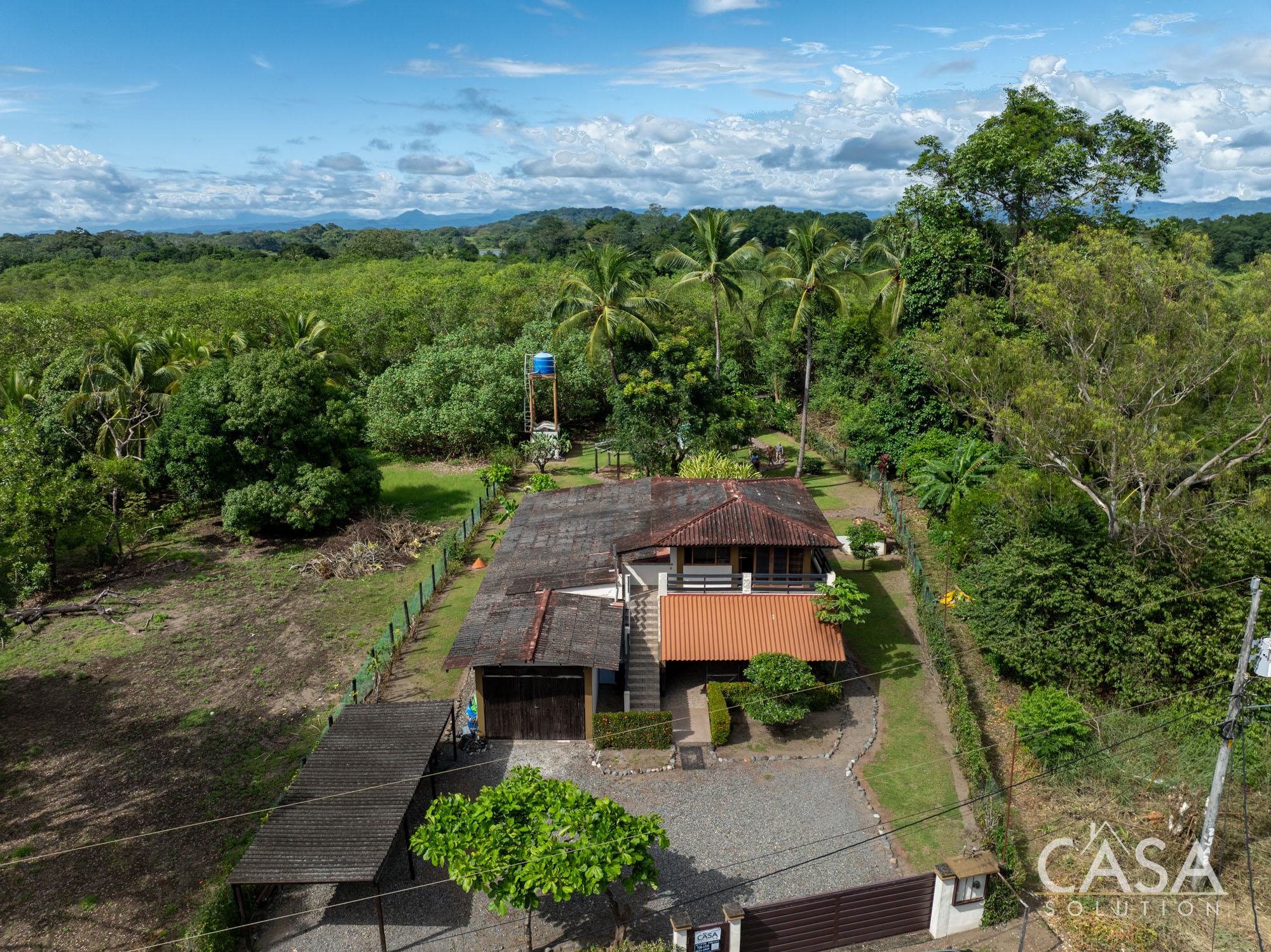 Contract Pending! Property for sale in Playa Las Lajas: home with 3 apartments, lagoon access, and tropical garden