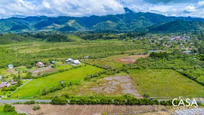 Flat Road-Front Lot for Sale on the Via a Caisan, Nueva California, Tierras Altas, Chiriqui – 9,089 m² with Creek, Views & Access