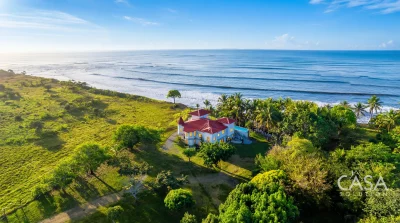 Beachfront estate home on 1.5 hectares in Playa Nanzal, Chiriquí, with 6 bedrooms, solar power, well water, pool, and direct ocean access