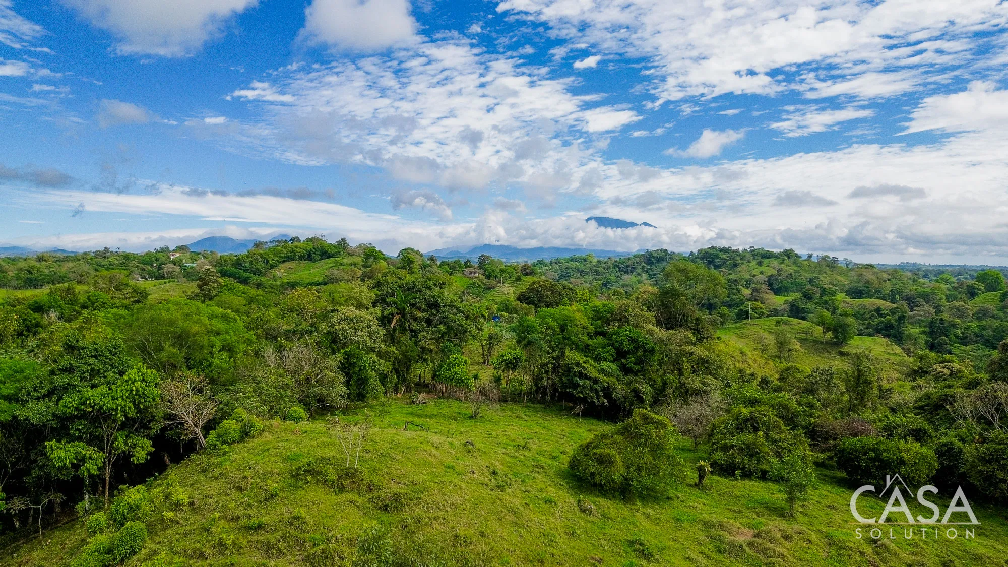 23-Hectare Land for Sale in Santa Rosa, Bugaba, Chiriquí – Two year-round rivers, fruit trees, hills, and views of the ocean and Volcán Barú