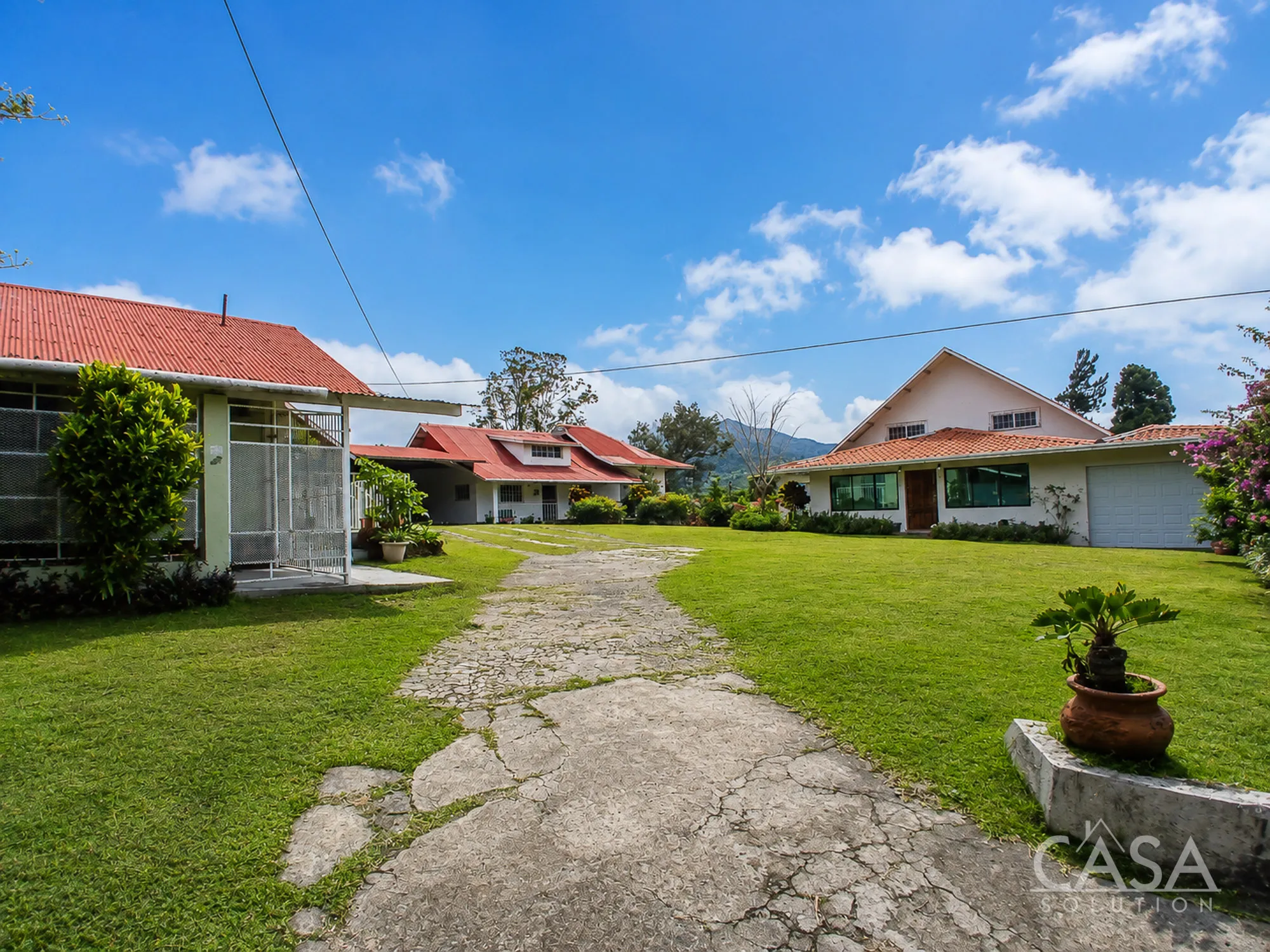 Four rental homes for sale in Alto Boquete, Boquete on a flat 1,900 m² lot with garages, laundry areas, and rental or Airbnb-style potential.