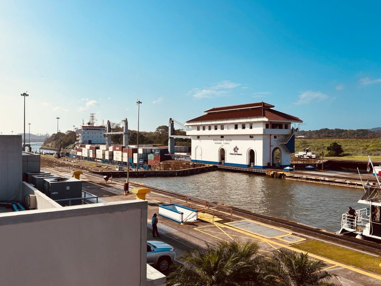 Cargo ship at the Panama Canal Miraflores Locks on a sunny day